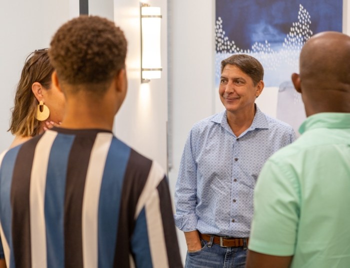 Group of people talking in dental office reception area