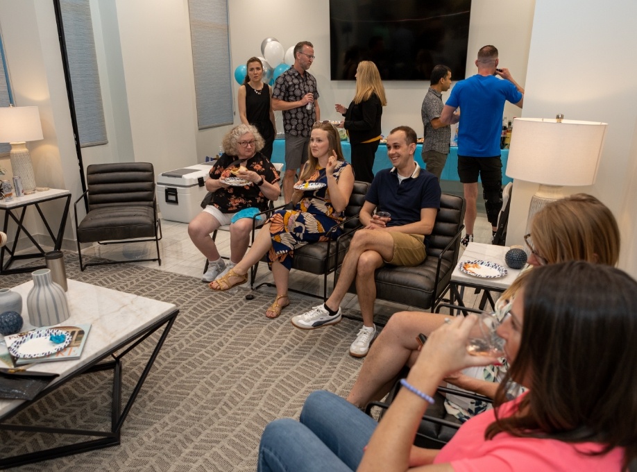 Group of people eating refreshments in dental office waiting room