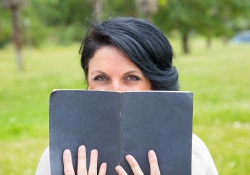 Woman reading book outdoors