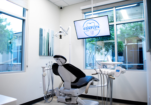 Dental exam room showing the Complete Dental Care Paradise Valley logo on computer screen