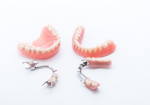 Sets of dentures against a white background