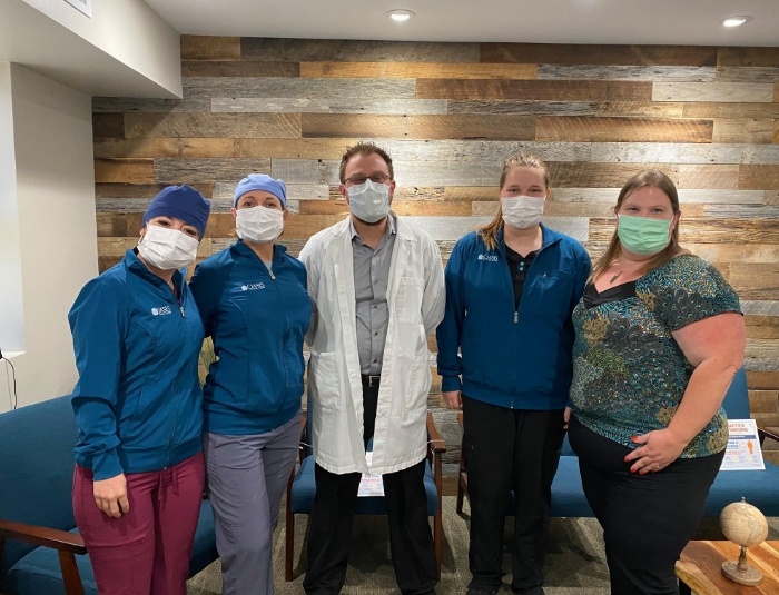 Phoenix dentist and dental team members wearing face masks