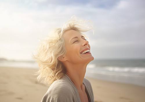 Smiling middle-aged woman on the beach