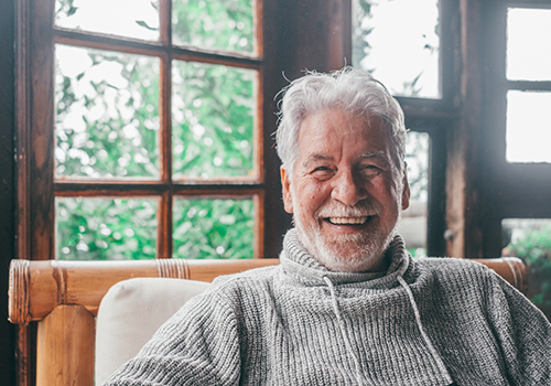 Closeup of senior man smiling at home