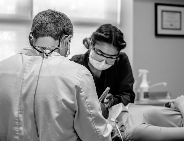 Doctor Rodda providing dental services to a patient