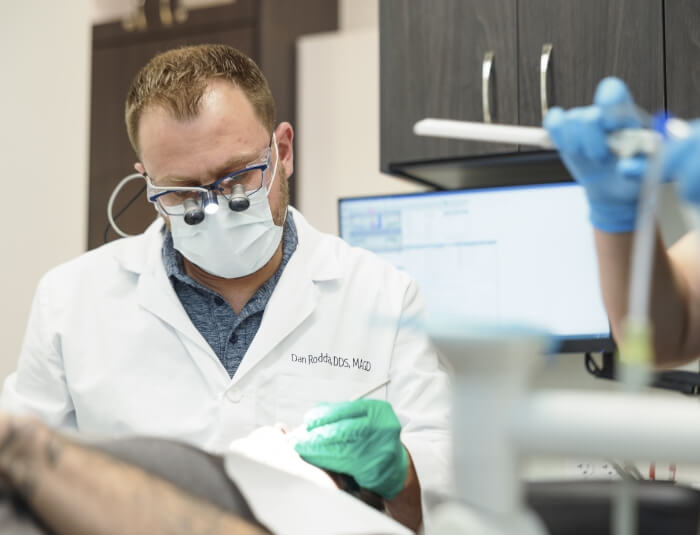 Doctor Rodda and team member treating a Phoenix dental patient