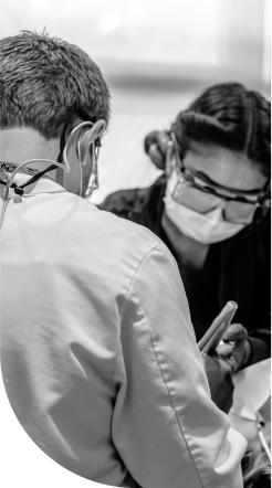 Doctor Rodda and dental assistant treating a dental patient