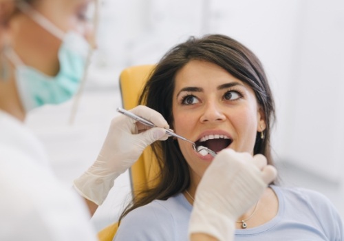 Dental patient opening her mouth during dental checkup