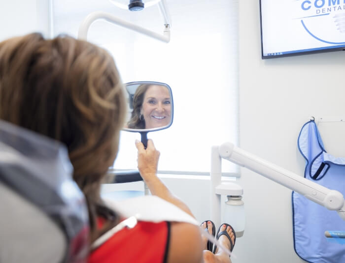 Doctor Rodda and dental assistant performing restorative dentistry treatment