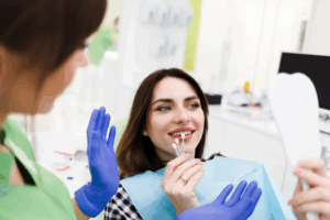 a patient smiling while receiving veneers