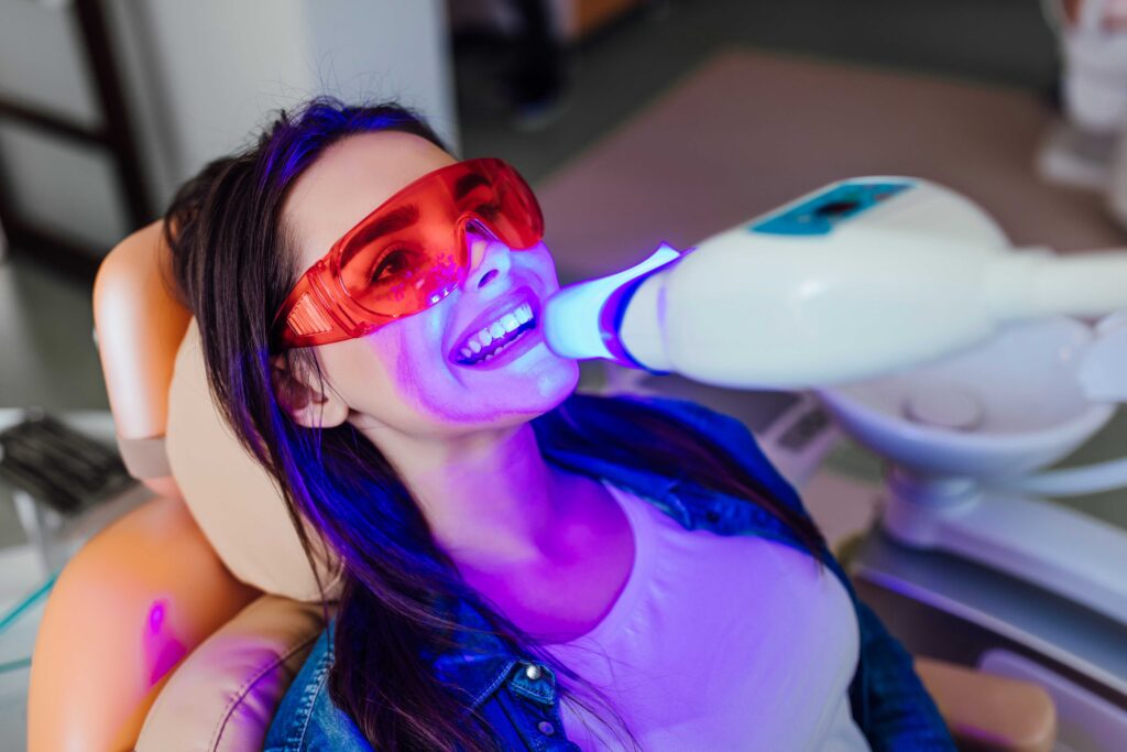 Woman having her teeth whitening